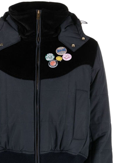 Hooded jacket decorated with pins