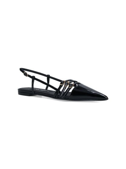 Dolce & Gabbana Slingback dettaglio cinturini-sandali bassi-Dolce & Gabbana-Slingback dettaglio cinturini Dolce & Gabbana, in pelle verniciata nera, a punta, dettaglio cinturini regolabili superiori e retro, suola in cuoio.-Dresso