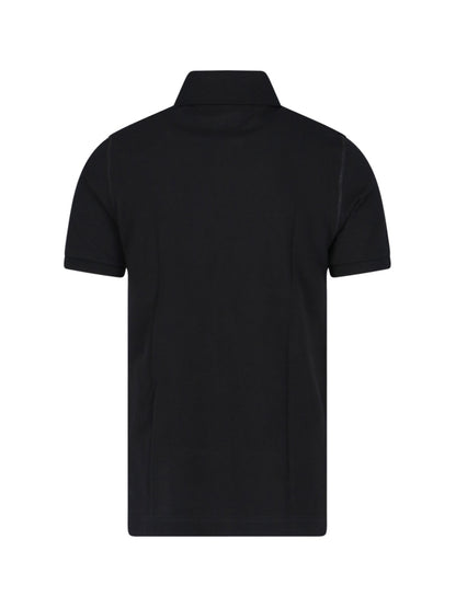 Dolce & Gabbana T-Shirt patch logo-t-shirt-Dolce & Gabbana-T-shirt patch logo Dolce & Gabbana, in cotone nero, colletto classico, chiusura bottoni, maniche corte, orlo dritto.-Dresso
