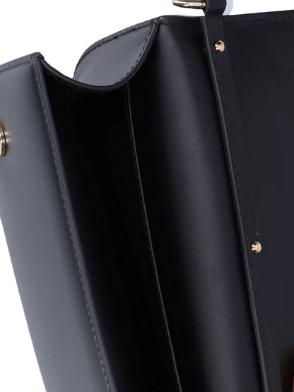 Dolce & Gabbana Borsa tracolla "DG"-borse a tracolla-Dolce & Gabbana-Borsa tracolla "DG" Dolce & Gabbana, in pelle nera, un manico superiore rimovibile, tracolla catena dorata, logo dorato fronte, una tasca piatta interna, uno scomparto interno principale.-Dresso
