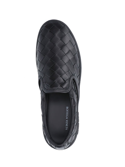 Bottega Veneta Sneakers slip-on intrecciate-sneakers basse-Bottega Veneta-Sneakers slip-on intrecciate Bottega Veneta, in pelle nera, motivo iconico intrecciato, vestibilità slip-on, etichetta logo applicato laterale, logo impresso suola, suola in gomma tono su tono.-Dresso