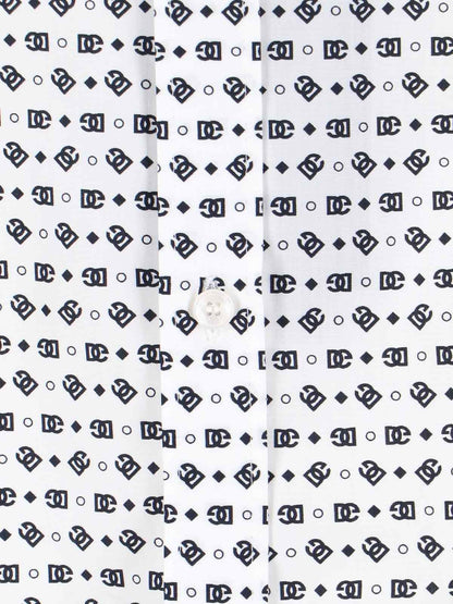 dolce & gabbana camicia logo-camicie-Dolce e Gabbana-camicia pois dolce & gabbana, in cotone bianco, motivo logo "dg" nero all-over, colletto classico, chiusura bottoni, bottoni polsini orlo tondo. codice prodotto g5kz0t hs5qchaxln composizione: 100% cotone dimensioni/vestibilità: regolare made in: italia - Dresso