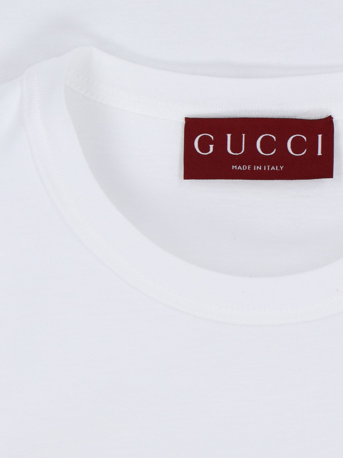 Gucci T-Shirt basic-t-shirt-Gucci-T-shirt basic Gucci, in cotone bianco, girocollo, maniche corte, etichetta tricolore retro, orlo dritto.-Dresso